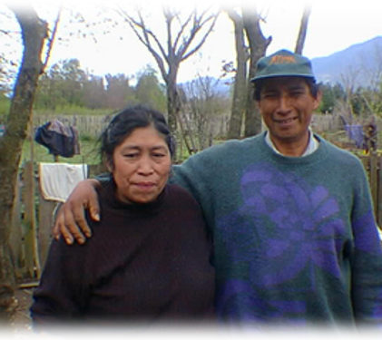 Mapuche couple receiving help - Gregory and his wife