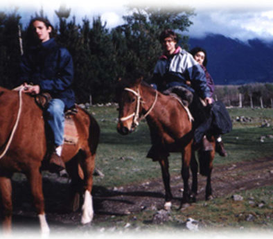 Youth on horseback - riding to visit